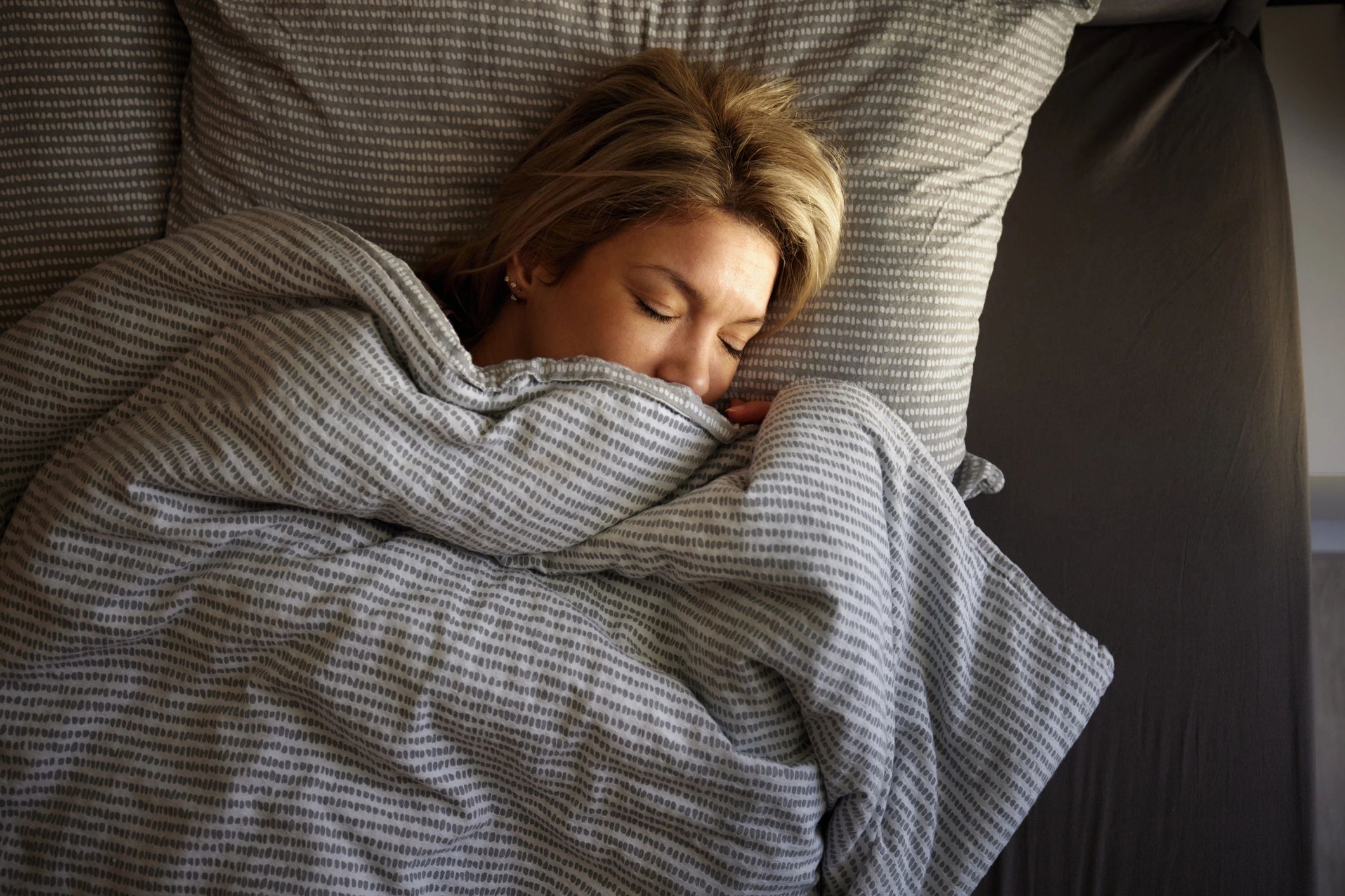 Serene person resting peacefully, representing deep relaxation